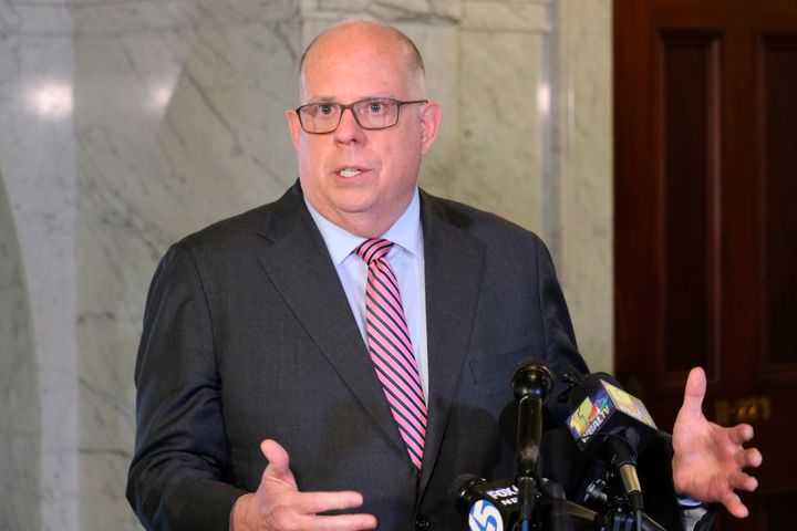 Maryland Gov. Larry Hogan talks to reporters after signing a measure to enact a new congressional map on April, 4, 2022.