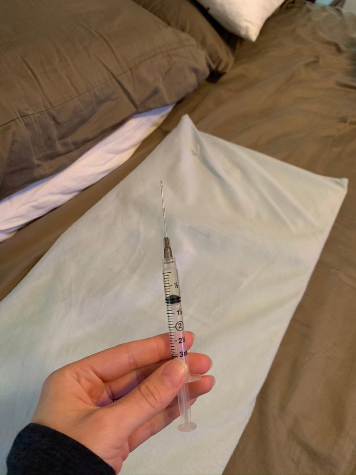 a needle the author had to use for progesterone shots in a recent round of IVF.