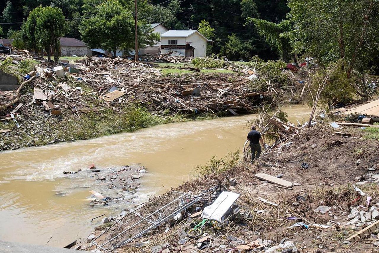 Search and rescue units in Kentucky look around Troublesome Creek for multiple people still missing after flooding swept through the area, on July 30.