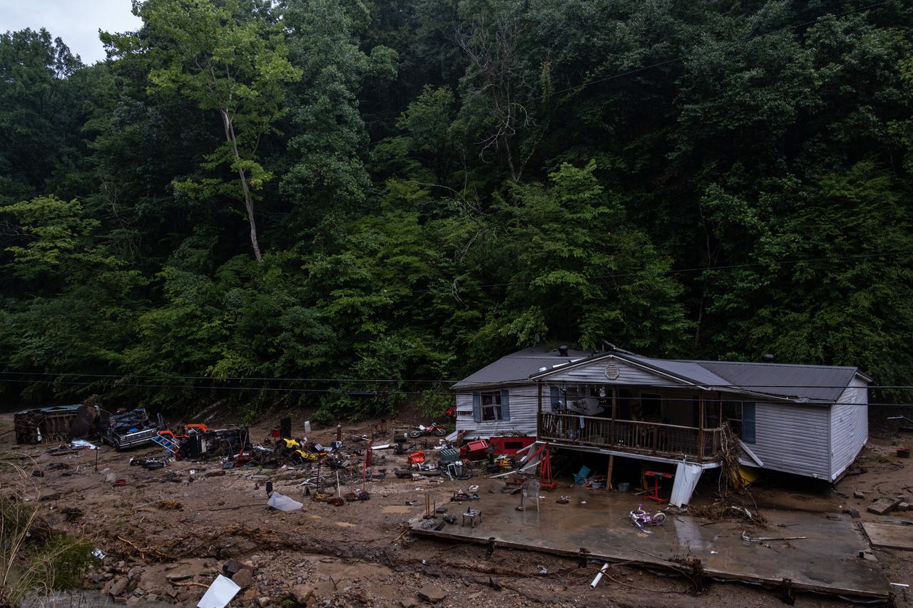 Debris surrounds a badly damaged home near Jackson, Kentucky, on July 31.