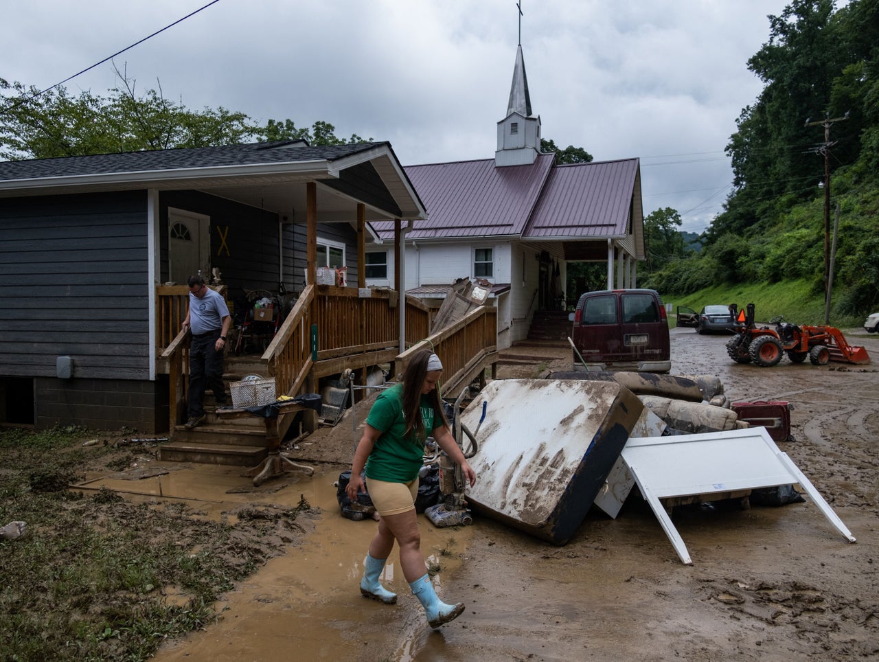 A local fire chief and his daughter drop off goods for a local community member in Jackson, Kentucky, on July 31. 