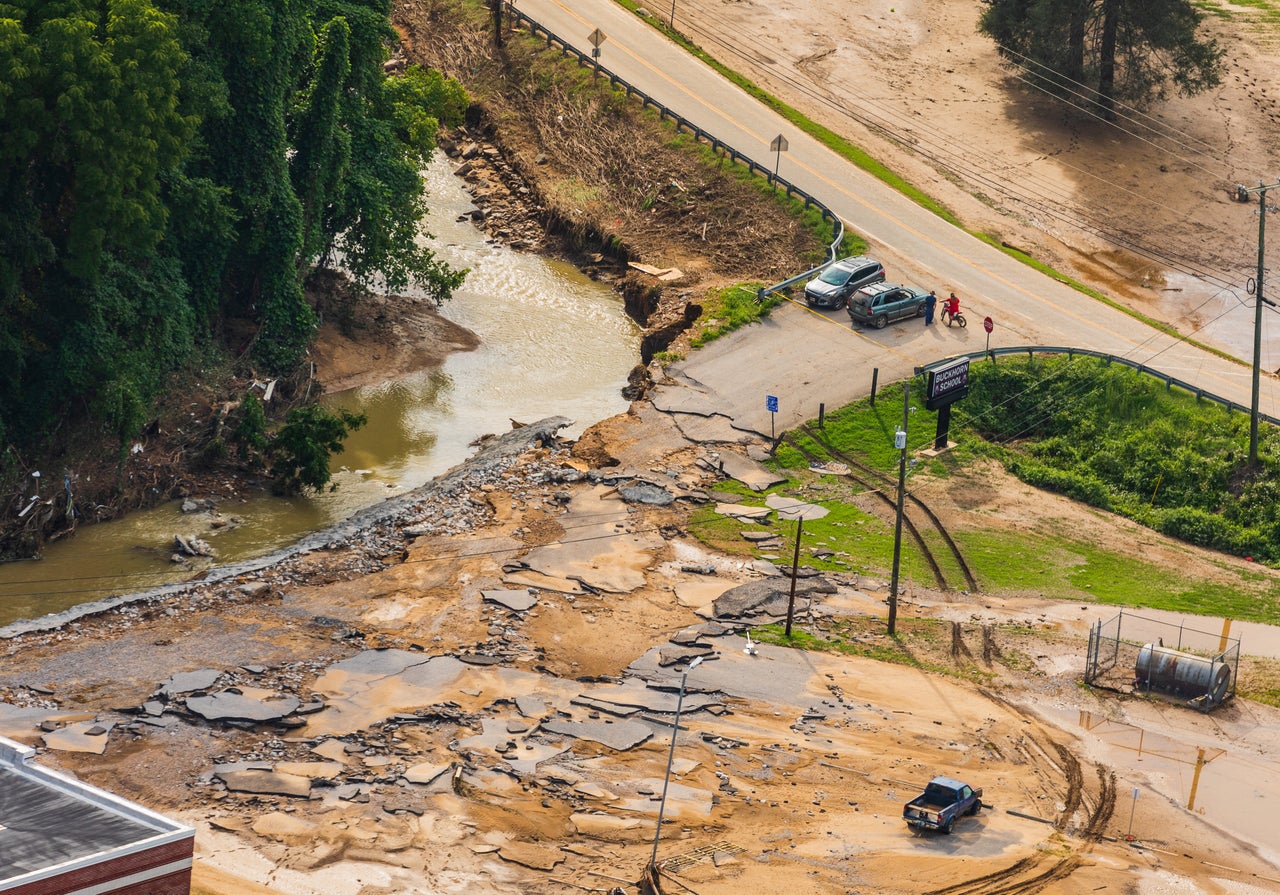 A Kentucky Army National Guard helicopter crew surveys disaster areas due to flooding during a media flight around eastern Kentucky, on July 30.