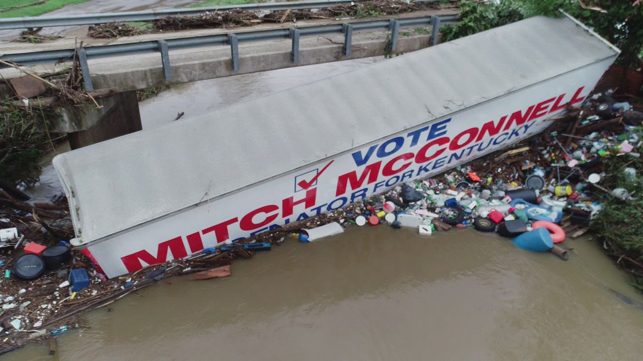 A trailer promoting U.S. Senate Republican leader Mitch McConnell lies in a waterway due to flooding in Whitesburg, Kentucky, on July 29.