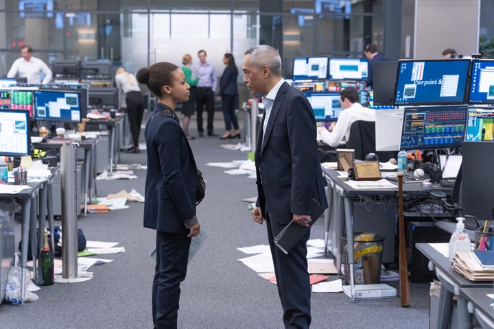 Throughout the series, Harper's toxic mentor-mentee relationship to her managing director Eric, played by Ken Leung (right), fluctuates depending upon her performance and behavior.