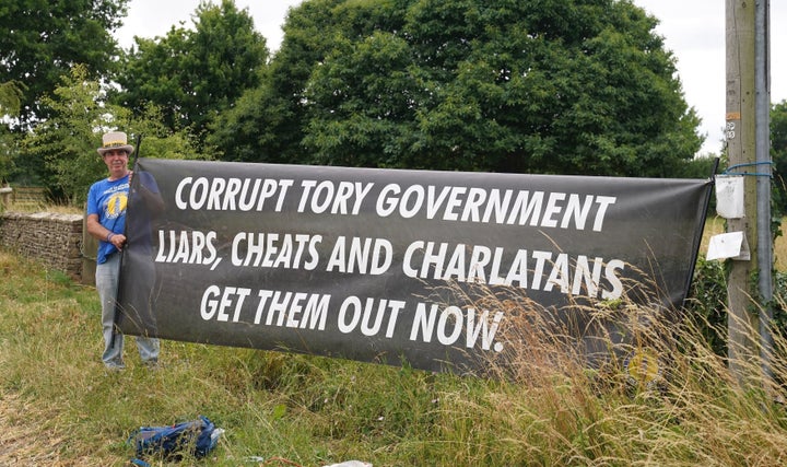 Protester Steve Bray demonstrates near Daylesford House, Gloucestershire, where Boris Johnson and wife Carrie held a first wedding anniversary party for friends and family.