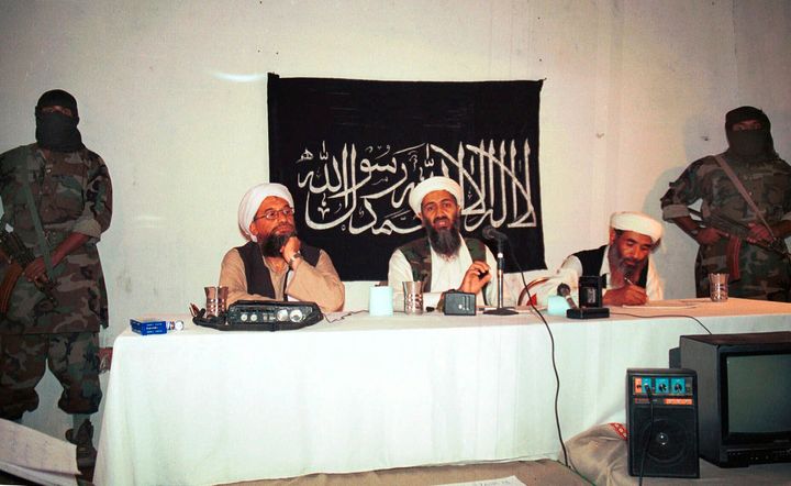 In this 1998 file photo, Ayman al-Zawahri, center left, and Osama bin Laden, center, hold a news conference in Afghanistan. 