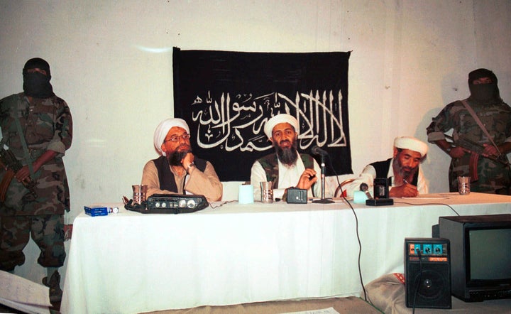 In this 1998 file photo, Ayman al-Zawahri, center left, and Osama bin Laden, center, hold a news conference in Afghanistan.