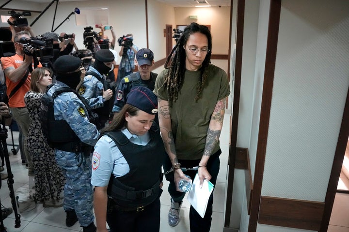 WNBA star and two-time Olympic gold medalist Brittney Griner is escorted in a court prior to a hearing, in Khimki, just outside Moscow, Russia, on Aug. 2, 2022. Since Brittney Griner last appeared in her trial for cannabis possession, the question of her fate expanded from a tiny and cramped courtroom on Moscow's outskirts to the highest level of Russia-US diplomacy.