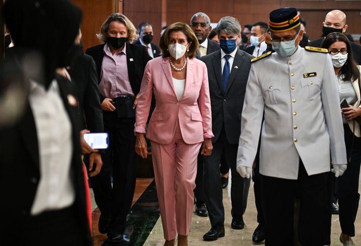 This handout photo taken and released by Malaysia’s Department of Information, U.S. House Speaker Nancy Pelosi, center, tours the parliament house in Kuala Lumpur, Tuesday, Aug. 2, 2022. Pelosi arrived in Malaysia on Tuesday for the second leg of an Asian tour that has been clouded by an expected stop in Taiwan, which would escalate tensions with Beijing.