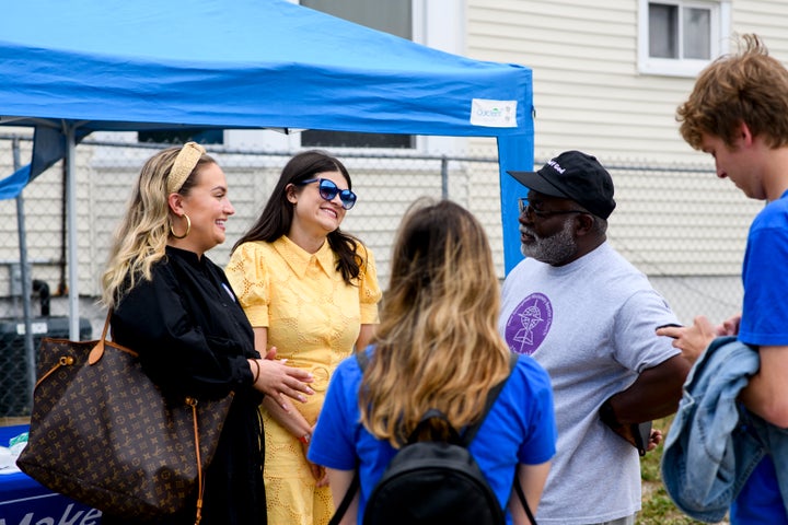 Stevens talks with Pontiac City Councilman William Parker Jr. at New Springfield Missionary Baptist Church in Pontiac, where Parker is the pastor, on July 23.