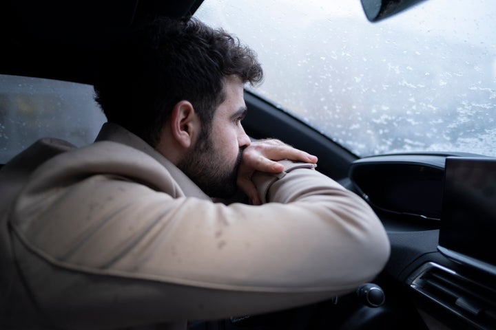 Sullen Young Man in a Car