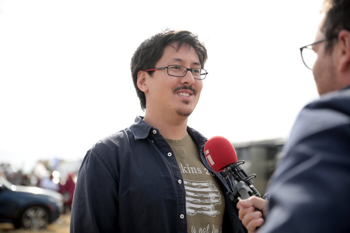 Ron Watkins, speaking with the media at a "Save America" rally in Florence, Arizona, denies being the writer behind QAnon.