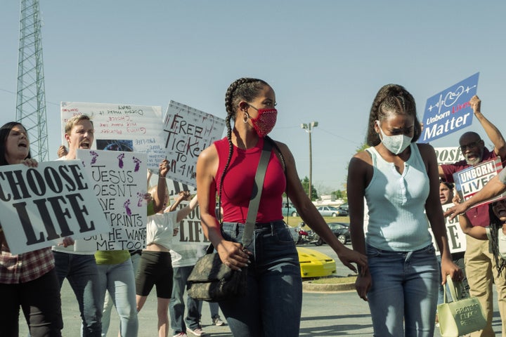 Mercedes (Brandee Evans) and her daughter Terricka (A’zaria Carter) go into an abortion clinic while surrounded by protesters in Season 2 of "P-Valley" on Starz.