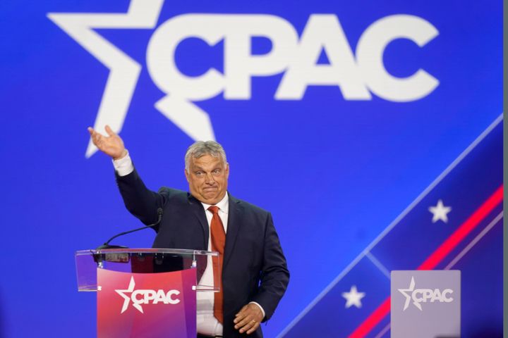 Hungarian Prime Minister Viktor Orban waves has he walks onto stage to speak at the Conservative Political Action Conference (CPAC) in Dallas.