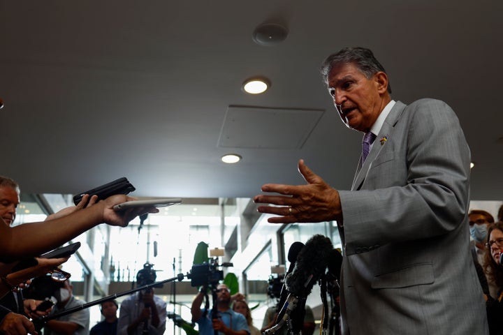 Sen. Joe Manchin (D-W.Va.) speaks to reporters outside his Senate office on Tuesday as negotiations continued on the Inflation Reduction Act.