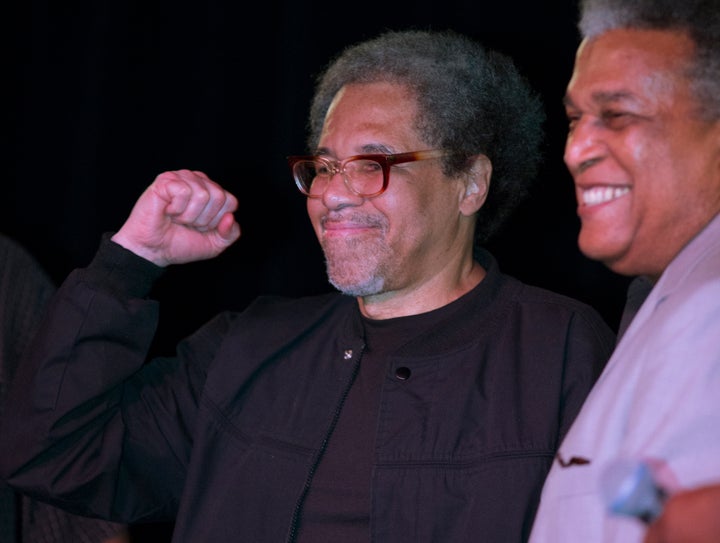 Albert Woodfox pumps his fist as he arrives on stage during his first public appearance at the Ashe Cultural Arts Center with Parnell Herbert, right, in New Orleans, on Feb. 19, 2016 after his released from Louisiana State Penitentiary in Angola, La. earlier in the day. Woodfox is the last of three high-profile Louisiana prisoners known as the "Angola Three" to be released.