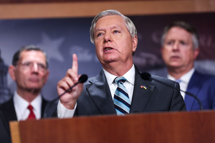 Sen. Lindsey Graham (R-S.C.), joined by Sen. John Barrasso (R-Wyo.), left, and Sen. Roger Marshall (R-Kan.), speaks a press conference at the U.S. Capitol on Friday.
