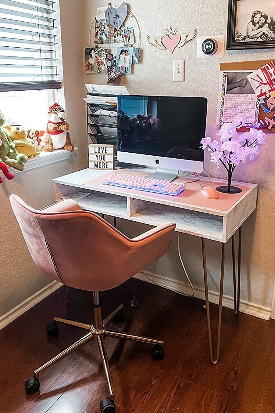 A faux-marble desk with metal hairpin legs