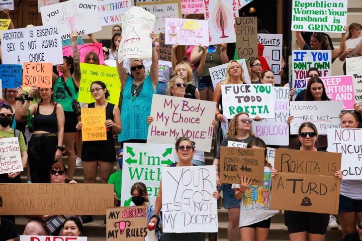 Protesters filled the Indiana State House in an effort to prevent the legislature from passing an abortion ban.