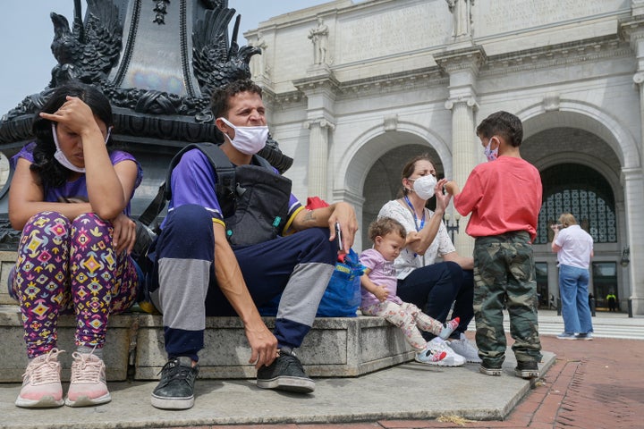 Víctor Rodríguez, 27, and his wife Ordalis Rodríguez, 26 — migrants originally from Venezuela who were transported on a bus from Texas — are seen with their children Jeremías, 5, and Luciana, 1, outside of Union Station in Washington, D.C., on April 13.