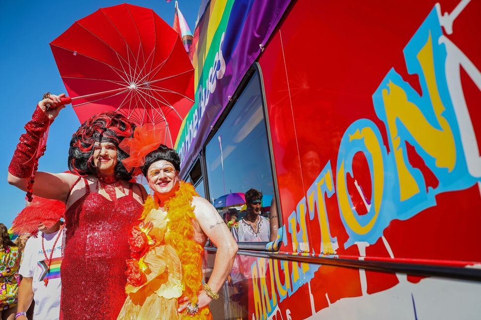 BRIGHTON, ENGLAND - AUGUST 06: Festival goers pose at the Pride LGBTQ+ Community Parade – ‘Love, Protest & Unity’ during the Brighton Pride on August 06, 2022 in Brighton, England. (Photo by Tristan Fewings/Getty Images)