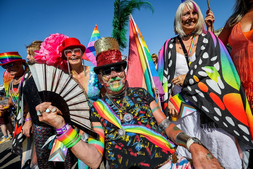BRIGHTON, ENGLAND - AUGUST 06: Festival goers participate in the Pride LGBTQ+ Community Parade – ‘Love, Protest & Unity’ during the Brighton Pride on August 06, 2022 in Brighton, England. (Photo by Tristan Fewings/Getty Images)