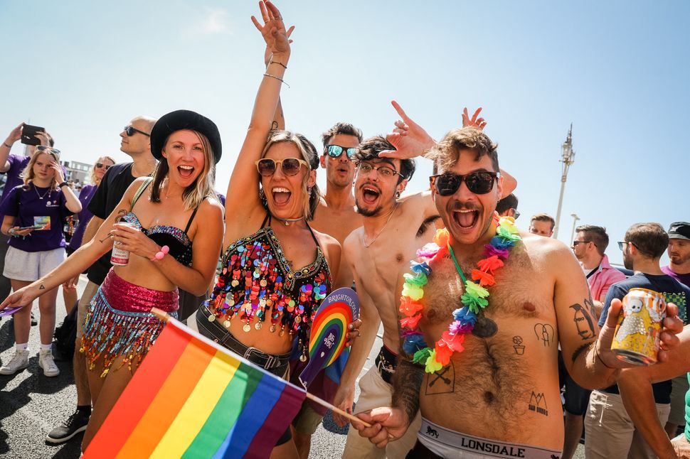 BRIGHTON, ENGLAND - AUGUST 06: Festival goers participate in the Pride LGBTQ+ Community Parade – ‘Love, Protest & Unity’ during attends Brighton Pride on August 06, 2022 in Brighton, England. (Photo by Tristan Fewings/Getty Images)