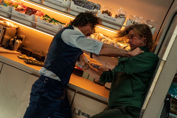 Aaron Taylor-Johnson and Brad Pitt in a scene from "Bullet Train." (Scott Garfield/Sony Pictures via AP)