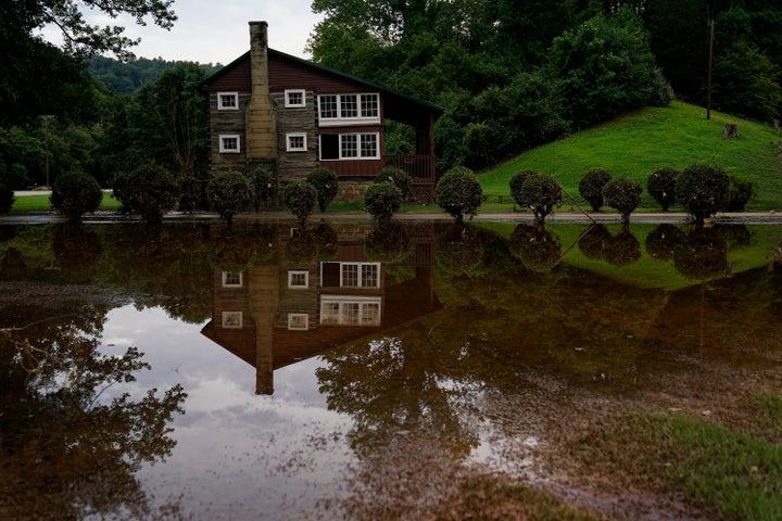 Standing water is seen over a week after massive flooding on Friday, Aug. 5, 2022, near Haddix, Ky.