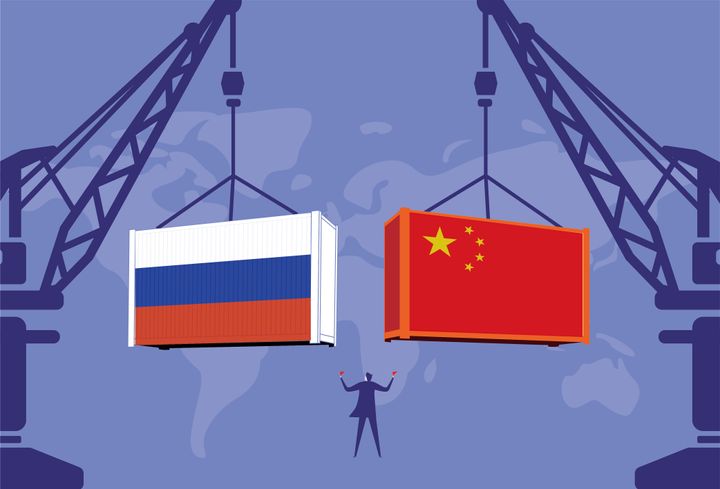Business men command the tower crane to lift Chinese containers and Russian containers