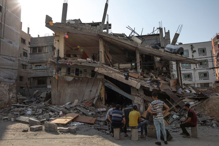 Palestinians inspect their house which was hit by an Israeli airstrike in Gaza City, on Aug. 8, 2022. A cease-fire between Israel and Palestinian militants has taken effect late Sunday in a bid to end nearly three days of violence that has killed dozens of Palestinians.