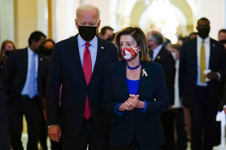 President Joe Biden walks with House Speaker Nancy Pelosi of Calif., on Capitol Hill in Washington, Friday, Oct. 1, 2021. (AP Photo/Susan Walsh, File)