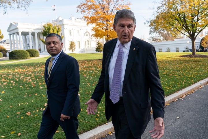 Dr. Rahul Gupta, left, the director of the White House Office of National Drug Control Policy, walks with Sen. Joe Manchin, D-W.Va., at the White House, Nov. 18, 2021, in Washington. (AP Photo/Alex Brandon, File)