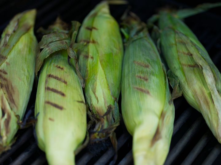 If you do opt to keep the husks on, you can stuff your corn with butter and seasonings before putting it on the grill.