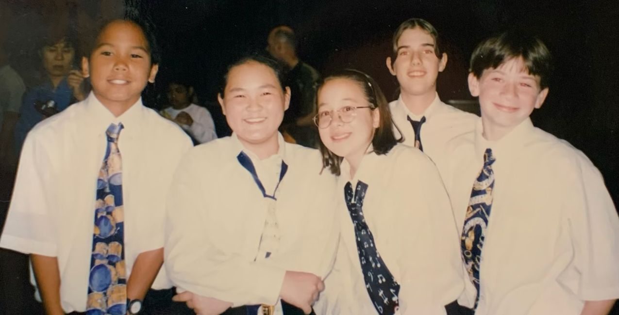 Michelle (center) and Kyle (far right) at a band recital in middle school.