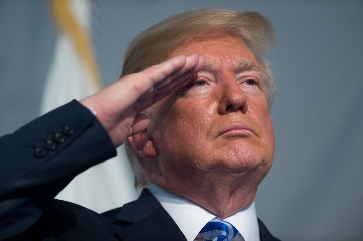 Former President Donald Trump salutes during a Change of Command ceremony in 2018.