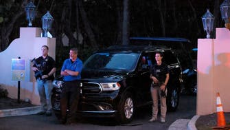 Armed Secret Service agents stand outside an entrance to former President Donald Trump's Mar-a-Lago estate, late Monday, Aug. 8, 2022, in Palm Beach, Fla. Trump said in a lengthy statement that the FBI was conducting a search of his Mar-a-Lago estate and asserted that agents had broken open a safe. (AP Photo/Terry Renna)