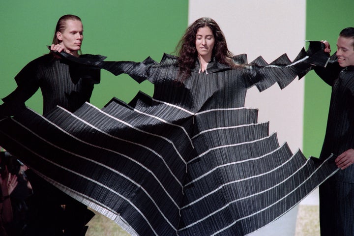 Models display a Pleats Please dress as part of Issey Miyake Autumn-Winter 1995 ready-to-wear collection in Paris on March 7, 1994.