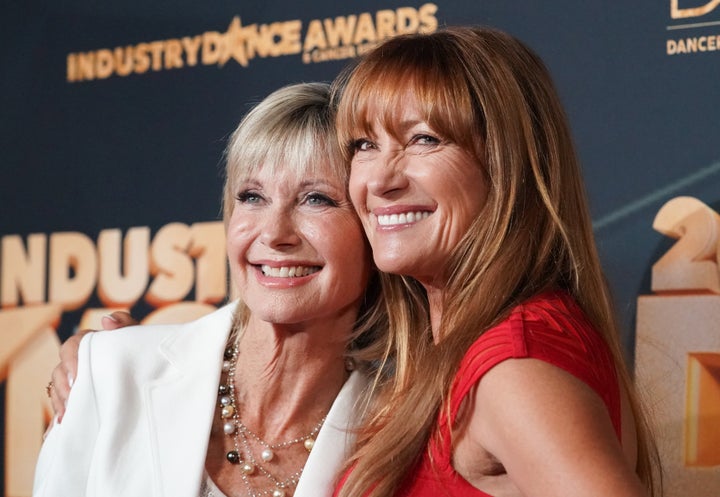 Olivia Newton-John and Jane Seymour pose for photos together at an event in 2019.