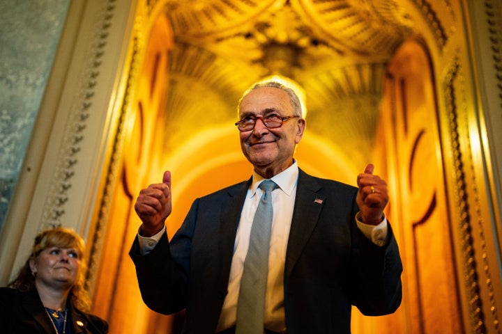 Senate Majority Leader Chuck Schumer celebrates the Democrats' "yuge" victory after the Senate passed the Inflation Reduction Act on Sunday.