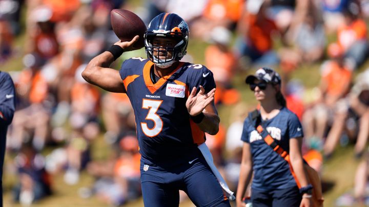 Denver Broncos quarterback Russell Wilson (3) takes part in drills during an NFL football training camp session at the team's headquarters Monday, Aug. 8, 2022, in Centennial, Colo. (AP Photo/David Zalubowski)