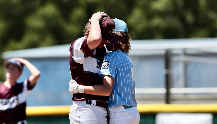 Players from Texas East (left) and Oklahoma console each other.