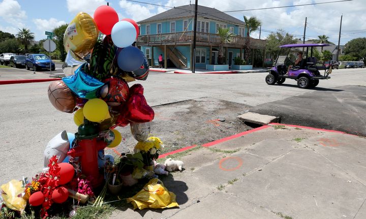 Balloons, flowers and stuffed animals have been left in the spot in Galveston, Texas where the victims lost their lives.