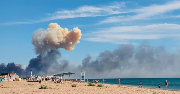 <strong>Rising smoke can be seen from the beach at Saki after explosions were heard from the direction of a Russian military airbase near Novofedorivka, Crimea.</strong>