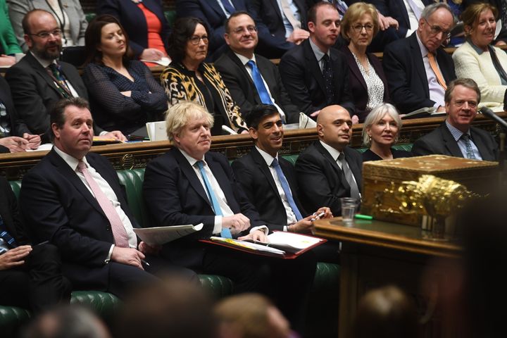 Commons Leader Mark Spencer sits next to Prime Minister Boris Johnson.