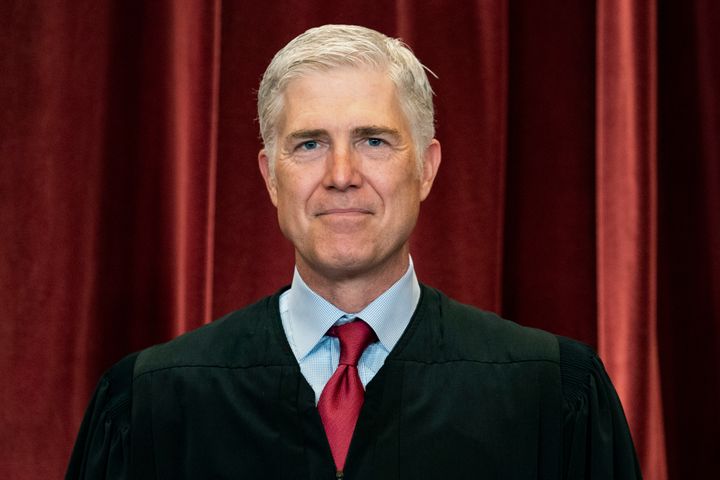 Associate Justice Neil Gorsuch stands during a group photo at the Supreme Court in Washington, April 23, 2021.