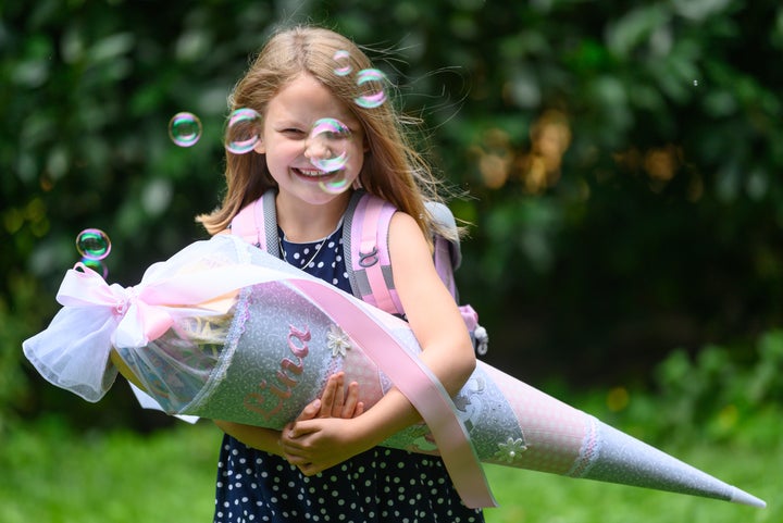 A little girl in Dresden poses with her cone in September 2021.