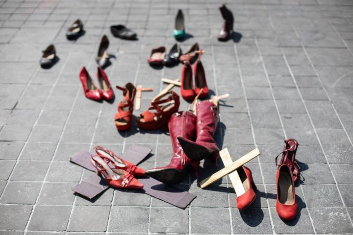 Red shoes and wooden crosses are scattered on the floor of the Zocalo (main square of Mexico City) on March 8th 2020 as part of the International Woman's Day March in Mexico. They were cleared up the following week. Each shoe representing a victim of femicide in Mexico, where an average of ten women are murdered every day. It is not an art exhibition or installation but part of the Women's March and protest this year in Mexico City.