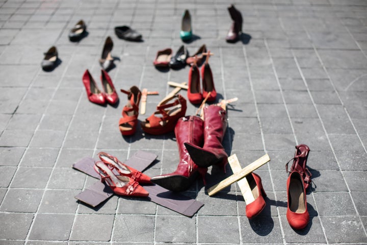 Red shoes and wooden crosses are scattered on the floor of the Zocalo (main square of Mexico City) on March 8th 2020 as part of the International Woman's Day March in Mexico. They were cleared up the following week.Each shoe representing a victim of femicide in Mexico, where an average of ten women are murdered every day. It is not an art exhibition or installation but part of the Women's March and protest this year in Mexico City.