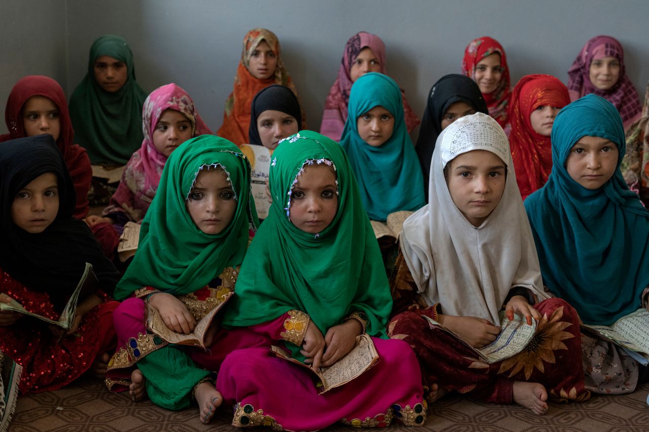 Afghan girls read the Quran in the Noor Mosque outside the city of Kabul, Afghanistan, on Aug 3, 2022. Maulvi Bakhtullah, the head of the mosque, said that the number of girls who come to this mosque to learn Quran has multiplied after the closure of public schools.